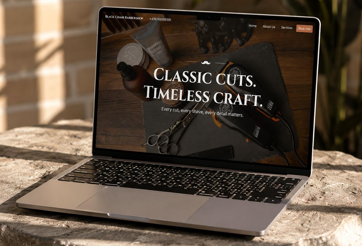 Black Chair Barbershop website on a laptop